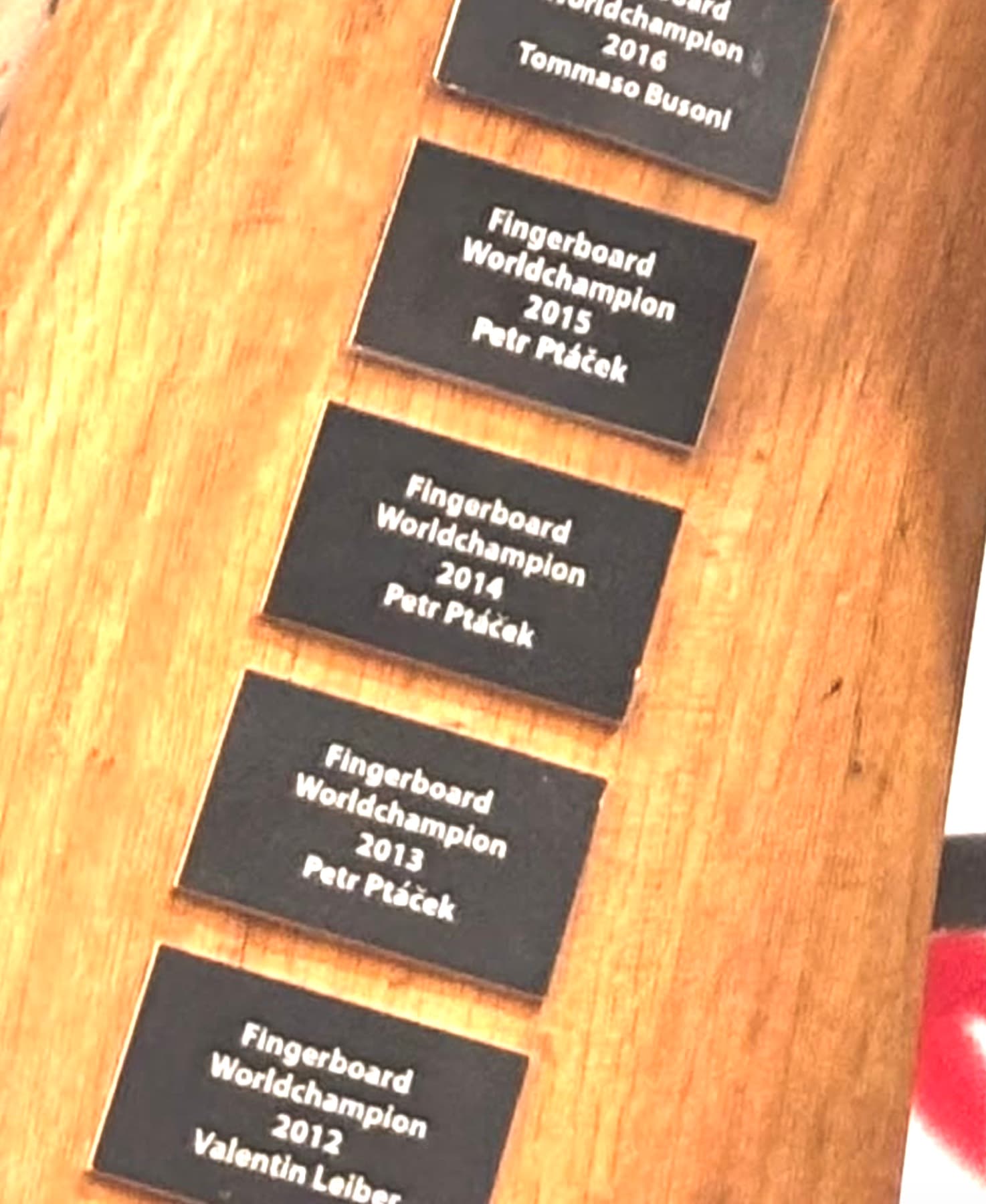 Fast Fingers trophy plaque detail including the 2016 champion engraving.