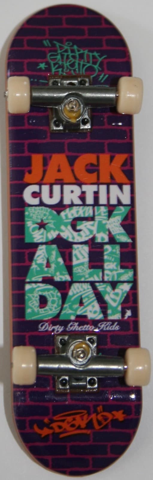A Tech Deck DGK Jack Curtin pro-model complete with a purple brick graphic, photographed top-down.